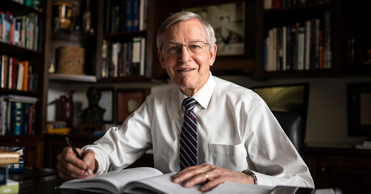 John W. Welch in his library