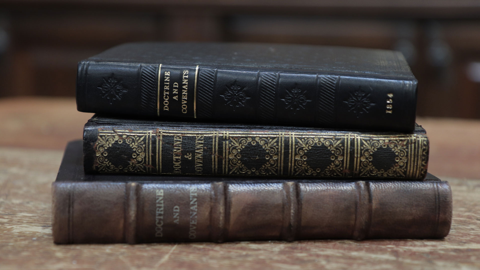 Antique editions of the Doctrine and Covenants, courtesy of Reid Moon. Photograph by Daniel Smith.