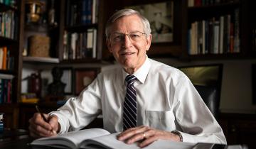 John W. Welch in his library